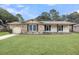 Charming single-story home with brick and siding accents, a well-manicured lawn, and a convenient attached garage at 305 Driver Ave, Summerville, SC 29483