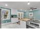 Kitchen with white cabinets, butcher block counters, and adjacent breakfast nook at 305 Driver Ave, Summerville, SC 29483
