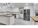 Modern kitchen with white cabinets, stainless steel appliances, and butcher block counters at 305 Driver Ave, Summerville, SC 29483