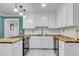 Modern kitchen featuring white cabinets, butcher block counters, and a subway tile backsplash at 305 Driver Ave, Summerville, SC 29483