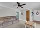 Comfortable living room with a sofa, ceiling fan, and access to the entryway at 305 Driver Ave, Summerville, SC 29483