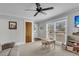 Cozy living room with carpet, ceiling fan, and a large window providing natural light at 305 Driver Ave, Summerville, SC 29483