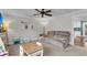 Comfortable living room with a plush sofa, table, and doorway to the kitchen at 305 Driver Ave, Summerville, SC 29483