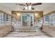 Sunroom with brick walls, vinyl floor, and view to the dining room at 305 Driver Ave, Summerville, SC 29483