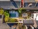 An aerial view features a manicured backyard with a pool, lounge chairs, and an outdoor dining area at 31 Hasell St, Charleston, SC 29401