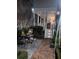 Backyard features a patio dining set, manicured hedges, and stairs leading to the porch at 31 Hasell St, Charleston, SC 29401