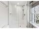 Modern bathroom featuring a glass-enclosed shower and classic subway tile at 31 Hasell St, Charleston, SC 29401