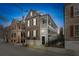 Charming brick home with a two-story porch and landscaped front yard at 31 Hasell St, Charleston, SC 29401