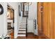 Welcoming foyer with staircase, hardwood floors, and stylish decor at 31 Hasell St, Charleston, SC 29401