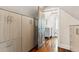 Hallway with a view into an updated gray bathroom at 31 Hasell St, Charleston, SC 29401