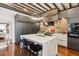 Modern kitchen with a large marble island, sleek cabinetry, and stainless steel appliances for culinary enthusiasts at 31 Hasell St, Charleston, SC 29401
