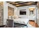 Stylish living room with a pull-out bed, exposed brick, and a modern design at 31 Hasell St, Charleston, SC 29401
