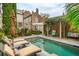 Inviting backyard pool with lounge chairs and lush landscaping at 31 Hasell St, Charleston, SC 29401