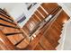 A beautiful interior shot of wooden staircase with dark wood banister at 31 Hasell St, Charleston, SC 29401