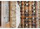 A close up of the wine storage rack, showcasing the bottles on display against the brick wall at 31 Hasell St, Charleston, SC 29401