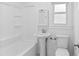Well-lit bathroom with a tub, shower, toilet and sink at 312 Mary Scott Dr, Goose Creek, SC 29445