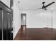 Elegant entryway with dark hardwood floors, white walls, and a view into the bathroom at 312 Mary Scott Dr, Goose Creek, SC 29445