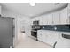 Modern kitchen featuring stainless steel appliances, white cabinets, and a sleek backsplash at 312 Mary Scott Dr, Goose Creek, SC 29445