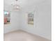 Bright living room with crown molding, decorative chandelier, and large windows for natural light at 312 Mary Scott Dr, Goose Creek, SC 29445