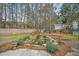 Backyard featuring a stone waterfall surrounded by lush foliage at 3216 Rose Walk Ct, Mount Pleasant, SC 29466