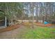 Large backyard featuring mature trees, landscaping, and a natural wooded area at 3216 Rose Walk Ct, Mount Pleasant, SC 29466