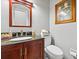 Powder room featuring granite countertop, under-mount sink, and wood vanity at 3216 Rose Walk Ct, Mount Pleasant, SC 29466