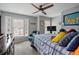 Cozy bedroom featuring neutral walls, a ceiling fan, and natural light at 3216 Rose Walk Ct, Mount Pleasant, SC 29466