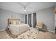 Cozy bedroom with a ceiling fan, a bed with pillows and a patterned rug at 3216 Rose Walk Ct, Mount Pleasant, SC 29466