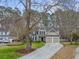 Charming two-story home with a well-manicured lawn and a two-car garage at 3216 Rose Walk Ct, Mount Pleasant, SC 29466