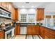 The kitchen features granite countertops and stainless steel appliances at 3216 Rose Walk Ct, Mount Pleasant, SC 29466