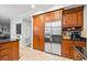 Kitchen featuring stainless steel refrigerator, custom cabinets, and granite countertops at 3216 Rose Walk Ct, Mount Pleasant, SC 29466