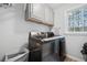 Functional laundry room with modern washer and dryer and overhead cabinet storage at 3216 Rose Walk Ct, Mount Pleasant, SC 29466