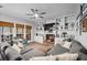 Bright living room featuring fireplace, built-in shelving, and comfortable gray sofa at 3216 Rose Walk Ct, Mount Pleasant, SC 29466
