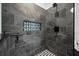 Close-up of a custom tiled shower with mosaic accent and modern fixtures at 3216 Rose Walk Ct, Mount Pleasant, SC 29466