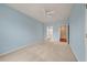 Light blue carpeted bedroom with ceiling fan and attached bathroom at 323 Waterlily Way, Summerville, SC 29486