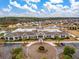 Aerial view of the community clubhouse, showcasing its architectural details and well-maintained landscaping at 323 Waterlily Way, Summerville, SC 29486