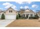 Charming single Gathering home with a two-car garage and manicured front yard at 323 Waterlily Way, Summerville, SC 29486