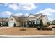 Inviting single-Gathering home with a manicured lawn and a welcoming front porch at 323 Waterlily Way, Summerville, SC 29486