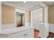 Welcoming foyer featuring hardwood floors and a seamless transition to a separate living space through glass doors at 323 Waterlily Way, Summerville, SC 29486