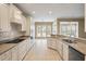 Bright kitchen featuring granite countertops, white cabinets, subway tile backsplash, and stainless steel appliances at 323 Waterlily Way, Summerville, SC 29486