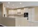 Bright kitchen with white cabinets, granite counters, and updated appliances at 323 Waterlily Way, Summerville, SC 29486