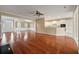 Open-concept living area with hardwood floors leading into the kitchen area at 323 Waterlily Way, Summerville, SC 29486