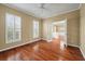 A naturally lit office has hardwood floors and plantation shutters at 323 Waterlily Way, Summerville, SC 29486