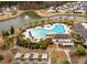 Overhead shot of community pool and amenity center, showcasing outdoor lounging and meticulously maintained landscaping at 323 Waterlily Way, Summerville, SC 29486