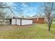 View of the backyard with a white storage shed in a fenced in yard at 3351 Londonderry Rd, North Charleston, SC 29420