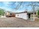 A detached garage in backyard with a covered area to the side at 3351 Londonderry Rd, North Charleston, SC 29420