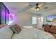 A modern bedroom with unique decorations, ceiling fan, and TV at 3351 Londonderry Rd, North Charleston, SC 29420