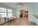 Bright dining area featuring a ceiling fan, sliding glass doors and light wood flooring at 3351 Londonderry Rd, North Charleston, SC 29420