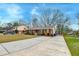 Traditional brick home with a long driveway and well-maintained lawn at 3351 Londonderry Rd, North Charleston, SC 29420