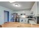 Well-lit kitchen with white cabinets, stainless steel appliances, and a butcher block island top at 3351 Londonderry Rd, North Charleston, SC 29420